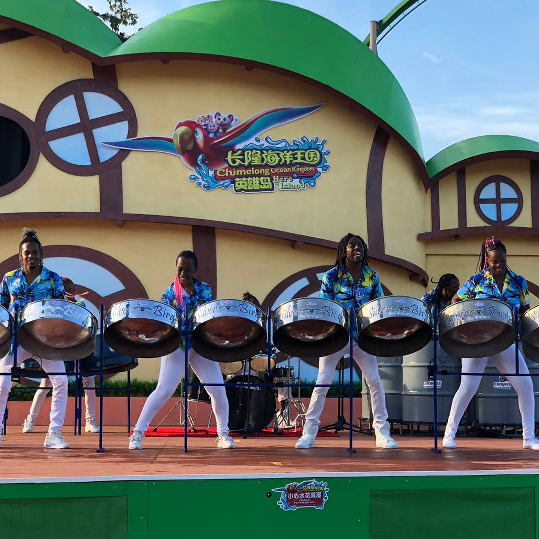 Group photo of the entire Silver Birds Steel Orchestra ensemble